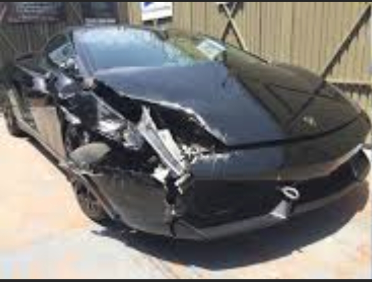 Luxury vehicle front end damage before repair